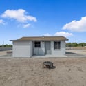 Exterior view of the detached casita showcases its private entrance and separate living quarters, providing an excellent option for guests, rental potential, or a home office.