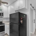 Bright kitchen space offers quality cabinetry, modern appliances, generous counter space, and easy access to the adjoining living area, delivering comfort and convenience.