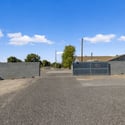Wide gated rear access offers convenient entry for RVs, trailers, recreational equipment, or extra vehicles while enhancing the flexibility and usability of this Goodyear property.