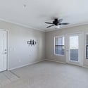 Bright windows, neutral finishes, and direct balcony access create an airy living space ready for your personal style. The open layout enhances both comfort and functionality.