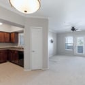 Enjoy an open-concept design where the kitchen flows effortlessly into the spacious living room with private balcony access. Rich wood cabinetry, updated appliances, and neutral finishes create a welcoming Scottsdale home.