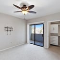 Enjoy direct balcony access from the primary bedroom along with a spacious walk-in closet featuring built-in drawers and shelving. Natural light and neutral d cor make this room warm and inviting.