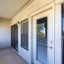 Enjoy generous outdoor living on this covered balcony with convenient access from both the primary bedroom and living room, providing an inviting space to relax in Scottsdale.