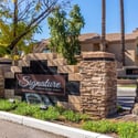 The attractive monument sign welcomes residents and guests to Signature Condominium Homes, a beautifully maintained Scottsdale community offering resort-inspired amenities and convenient living.