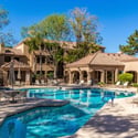 The inviting community pool offers a resort-inspired setting with expansive sundecks, lounge chairs, mature landscaping, and relaxing common areas for residents to enjoy.