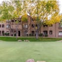 Mature trees, manicured lawns, and attractive architecture create a welcoming atmosphere throughout this well-maintained Scottsdale condominium community.