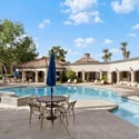 Experience resort-style amenities including a sparkling swimming pool, spa, shaded seating areas, and beautifully landscaped gathering spaces designed for relaxation and recreation in Scottsdale.