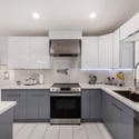 Clean lines, quartz surfaces, stainless steel appliances, and abundant cabinetry make this renovated kitchen both beautiful and highly functional. An ideal centerpiece for this Scottsdale home.