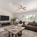 Gather in this spacious family room featuring plantation shutters, recessed lighting, and an open-concept layout that flows into the updated kitchen. Designed for comfortable Scottsdale living and entertaining.