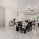 The formal dining area offers generous entertaining space with large windows, modern finishes, and easy flow throughout the home. A versatile gathering space perfect for holidays and family celebrations.