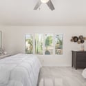 Enjoy peaceful mornings in this bright primary suite featuring plantation shutters, spacious proportions, and elegant finishes. This comfortable Scottsdale bedroom offers both privacy and everyday convenience.
