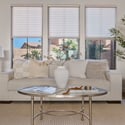Large windows, elegant finishes, and a spacious layout make this formal living room an inviting space for entertaining or relaxing while enjoying the comfort and luxury of this Scottsdale residence.
