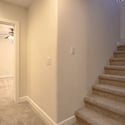 This staircase provides seamless access to the finished basement, expanding the home's living space with room for recreation, entertaining, and flexible lifestyle needs.