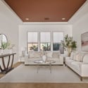 Featuring a tray ceiling, large windows, plush carpeting, and stylish finishes, this formal living room offers flexible space for entertaining, conversation, or quiet relaxation.