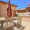 Entertain outdoors on the private courtyard featuring paver patios, built-in BBQ, dining space, and low-maintenance landscaping that extends the home's indoor-outdoor lifestyle in Scottsdale.