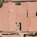 This aerial image showcases the home's roofline, private courtyard, custom pool, and overall property layout, highlighting exceptional outdoor amenities and thoughtful design.