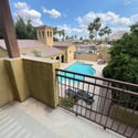 Step onto the private balcony to enjoy elevated views of the community pool, mature landscaping, and mountain backdrop. This peaceful outdoor space adds exceptional value to this Phoenix property.