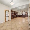 Enjoy effortless entertaining with an open-concept design connecting the living room, custom built-in cabinetry, and beautifully remodeled kitchen filled with premium finishes and modern style.