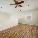 An expansive upstairs loft with updated flooring and ceiling fan offers the flexibility to create a home office, media room, fitness area, or playroom to fit your lifestyle.