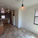 Spacious kitchen with breakfast bar, extensive cabinetry, ample prep space, and a layout that flows effortlessly into the main living area, making daily living both comfortable and convenient.