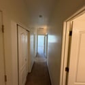 Interior hallway connects the bedrooms and bathrooms while creating a quiet separation from the home's main gathering areas. A thoughtful floor plan for added privacy.