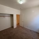 Comfortable bedroom featuring soft carpeting, generous closet storage, and a versatile layout ready to fit your lifestyle needs.