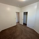 Well-sized bedroom with neutral d cor, generous closet storage, and plenty of space for comfortable everyday living.