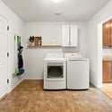 A laundry space is located directly off the kitchen.