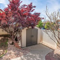 An included storage shed provides additional storage space for outdoor needs.