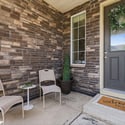 Enjoy a cozy covered porch for welcoming friends.