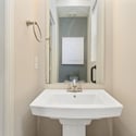 A powder bath is located at the entry of the home.