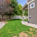 A side yard offers additional space for recreation.