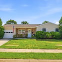 Well-maintained single-story home with lush landscaping and easy access to local amenities.