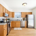 Bright, spacious kitchen featuring modern appliances, ample cabinetry, and an inviting layout perfect for entertaining.