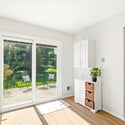 Bright and airy kitchen with sliding glass doors leading to a private outdoor space.