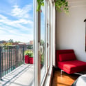 Bright, airy bedroom featuring a spacious balcony, inviting natural light and outdoor views.
