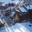 This aerial view showcases the pools at Trailhead Lodge, amenities available to Wildhorse Meadows homeowners and guests. Perfect for winding down after an athletic day in the great outdoors.