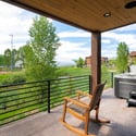 Enjoy stunning views and peaceful surroundings from this inviting outdoor deck with a hot tub.