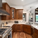 Beautifully designed gourmet kitchen featuring a 48" gas range, a 48 " built-in refrigerator, GE Monogram appliances, ample counter space, and counter seating.