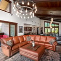 Spacious great room connects to the gourmet kitchen and dining areas. Sliding glass doors open to a back deck featuring Emerald Mountain views.