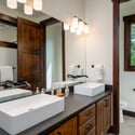 Modern bathroom featuring dual sinks, ample natural light, and a thoughtfully designed layout for convenience.