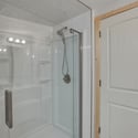 Modern glass shower with sleek fixtures, offering a fresh and functional space for daily routines.