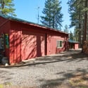 30'x40' shop with a 30'x16.5' RV bay and two additional 22'x14' rooms. The 2-car oversized garage has an insulated storage area with baseboard heat. Outside is a 12'x6' shed and a 16'x6' covered wood storage area. The detached pump house/greenhouse is 12'x8'.