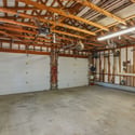 The 2-car oversized garage has heated storage, dedicated wood storage, and a storage room. Plus exterior shed and wood storage.