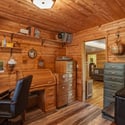 Cozy office space featuring ample storage, natural light, and a peaceful ambiance for productivity.