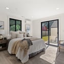 Main level primary bedroom w/ 3/4 bath en suite