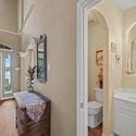Spacious entryway featuring natural light, a welcoming atmosphere, and easy access to a convenient half-bath.