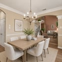Bright and inviting dining area features a spacious table, natural light, and a seamless flow to the living space.