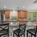 Bright and inviting kitchen features modern appliances, ample counter space, and a cozy breakfast area.