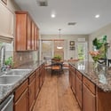 Bright and spacious open-concept kitchen featuring modern finishes and ample natural light throughout.